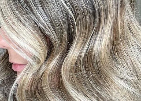 Blonde hair in soft waves at The Loft BB7, Clitheroe, England, GB. Highlighted elegance.