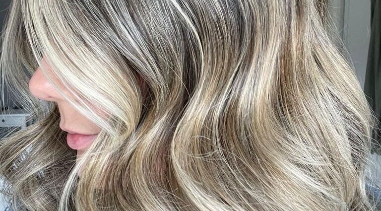 Blonde hair in soft waves at The Loft BB7, Clitheroe, England, GB. Highlighted elegance.