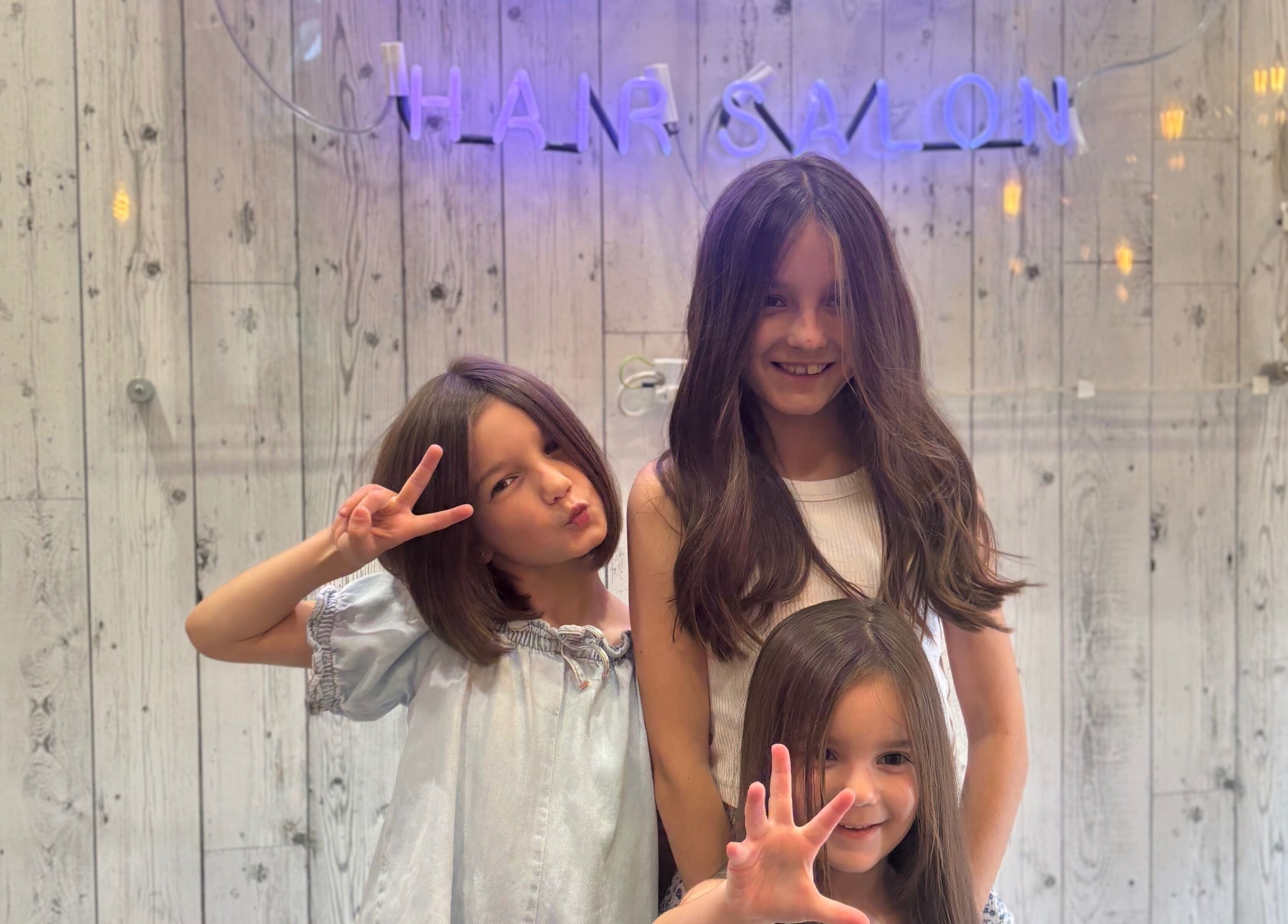 Children enjoying a day at The Loft BB7 hair salon in Clitheroe, England, GB.