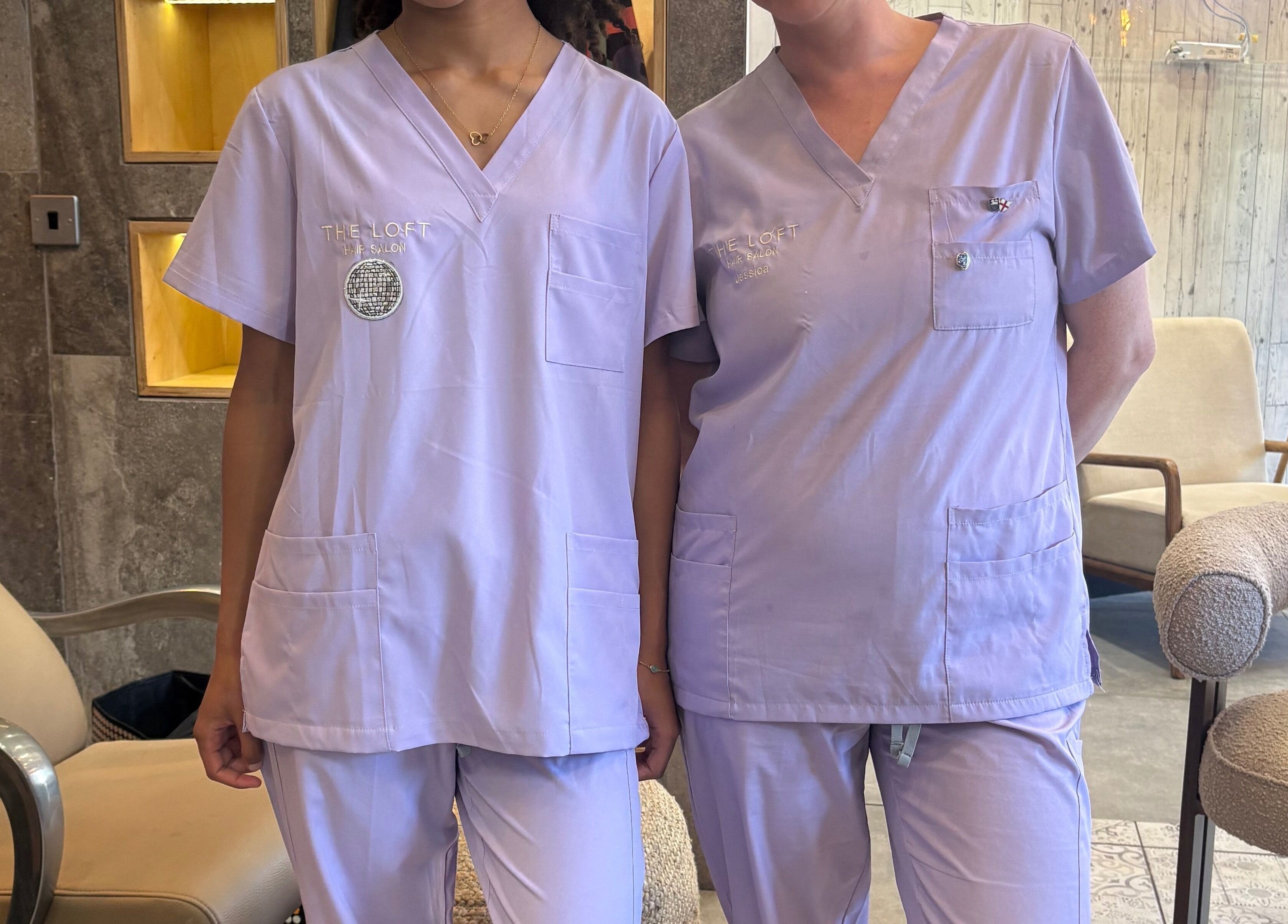 Two team members in lavender uniforms at The Loft BB7, Clitheroe, England, GB
