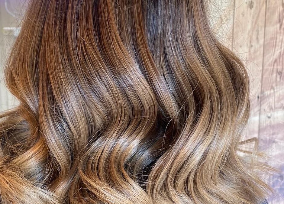 Elegant, wavy hairstyle at The Loft BB7, Clitheroe, England, GB, showcasing vibrant color and texture.