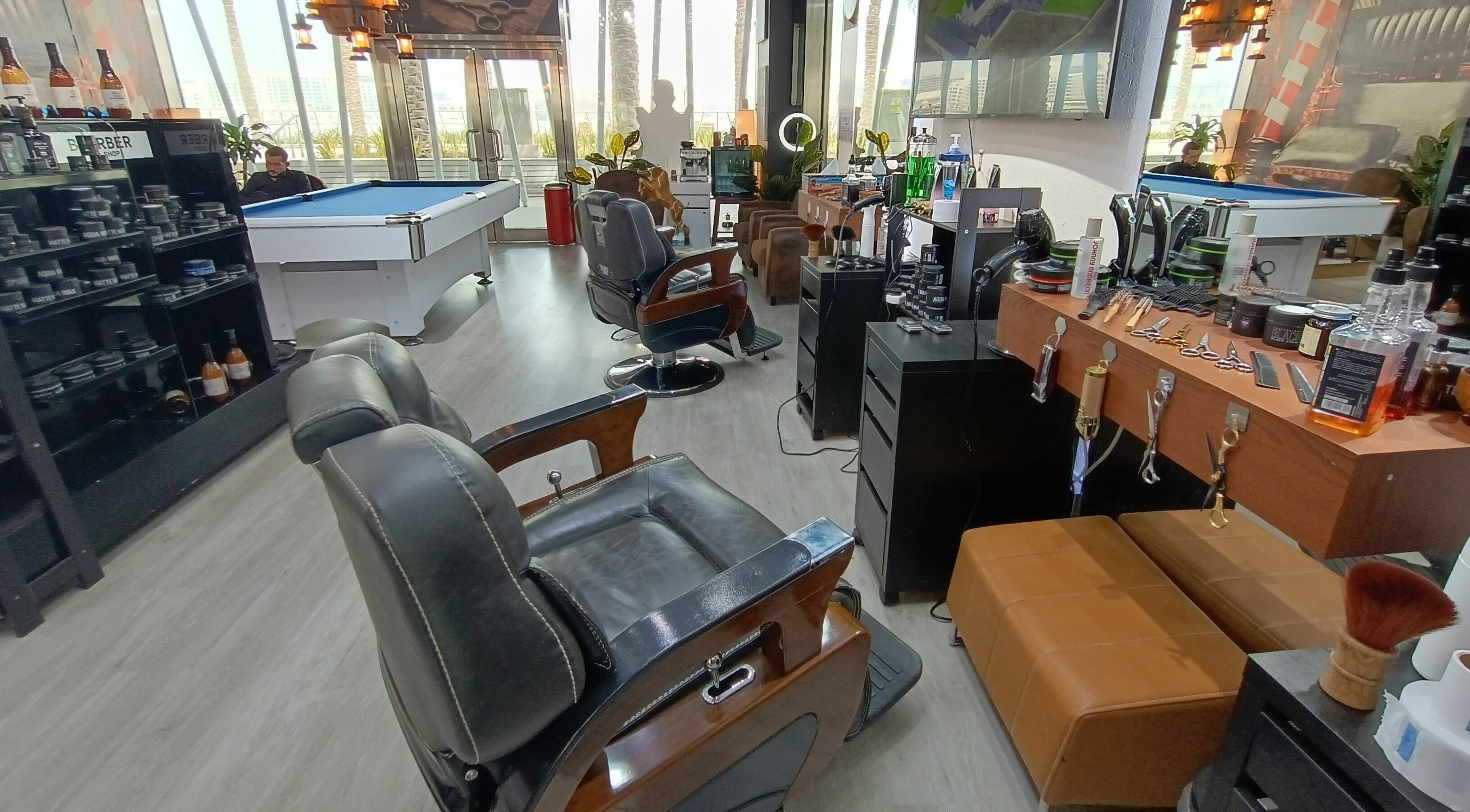 Modern interior of Maurice Cut Barbershop in أبو ظبي, أبو ظبي, AE showcasing stylish chairs and grooming tools.