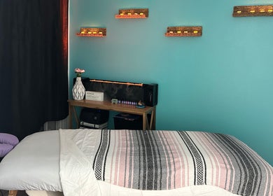 Tranquil spa room at BelaVita Wellness in Winter Garden, Florida, US, featuring a massage table and soothing decor.