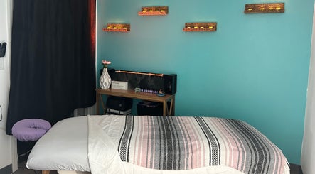 Tranquil spa room at BelaVita Wellness in Winter Garden, Florida, US, featuring a massage table and soothing decor.