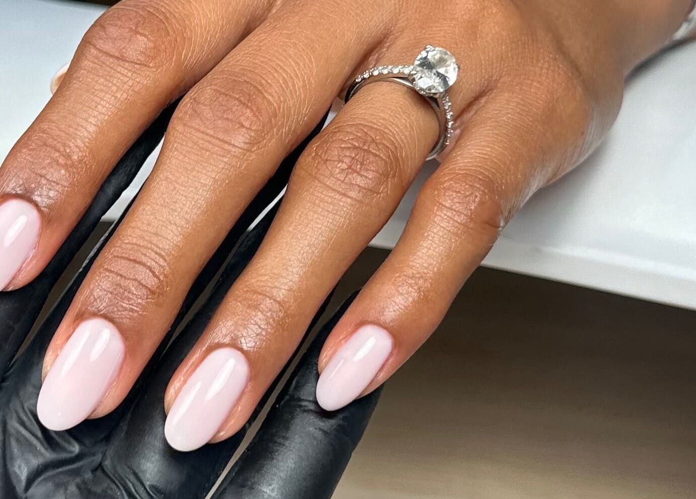 Elegant nail art at Nails By Cátia Patrícia, Edgware, England, GB showcasing polished, oval-shaped nails.