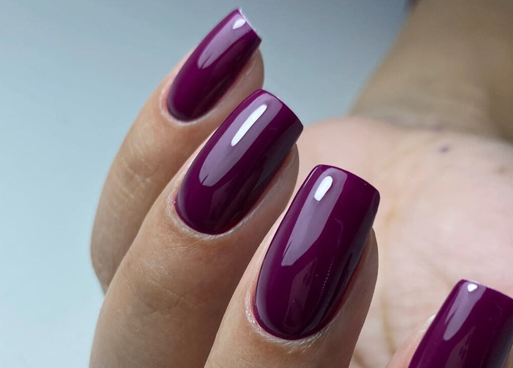 Stylish plum-colored nails from Nails By Cátia Patrícia, Edgware, England, GB, showcasing elegant manicure.