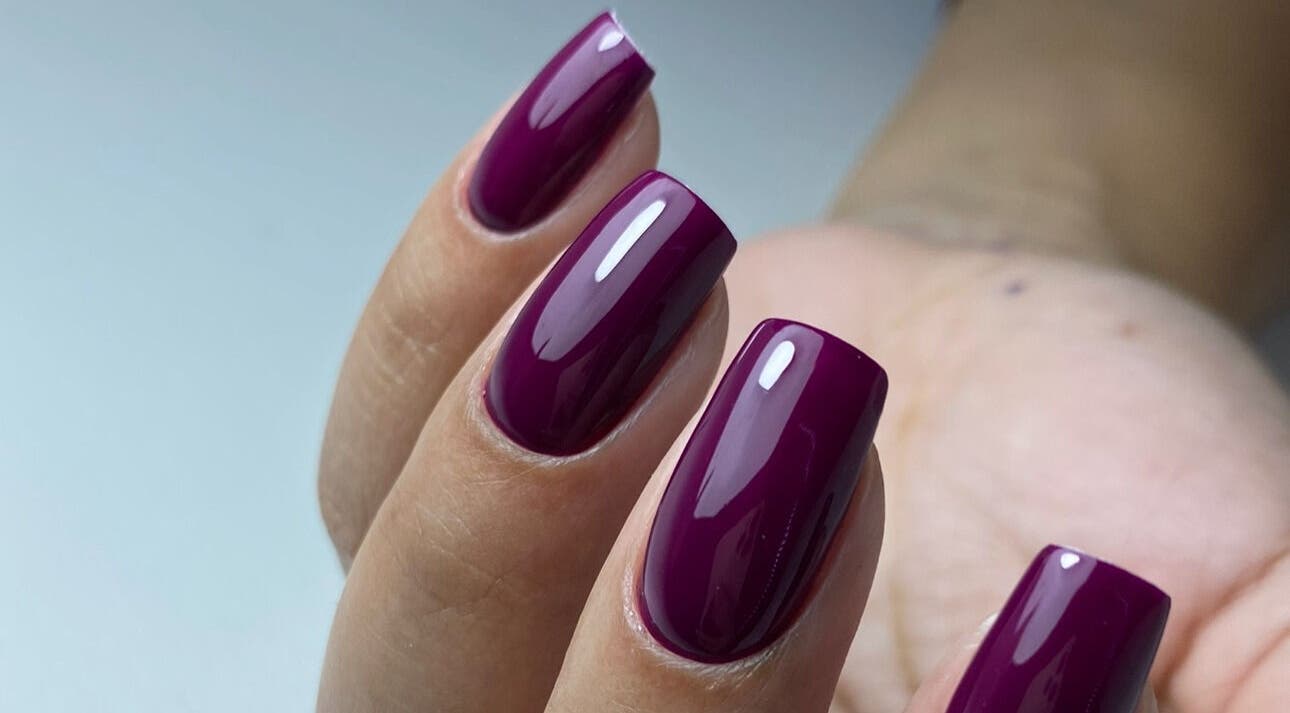 Stylish plum-colored nails from Nails By Cátia Patrícia, Edgware, England, GB, showcasing elegant manicure.