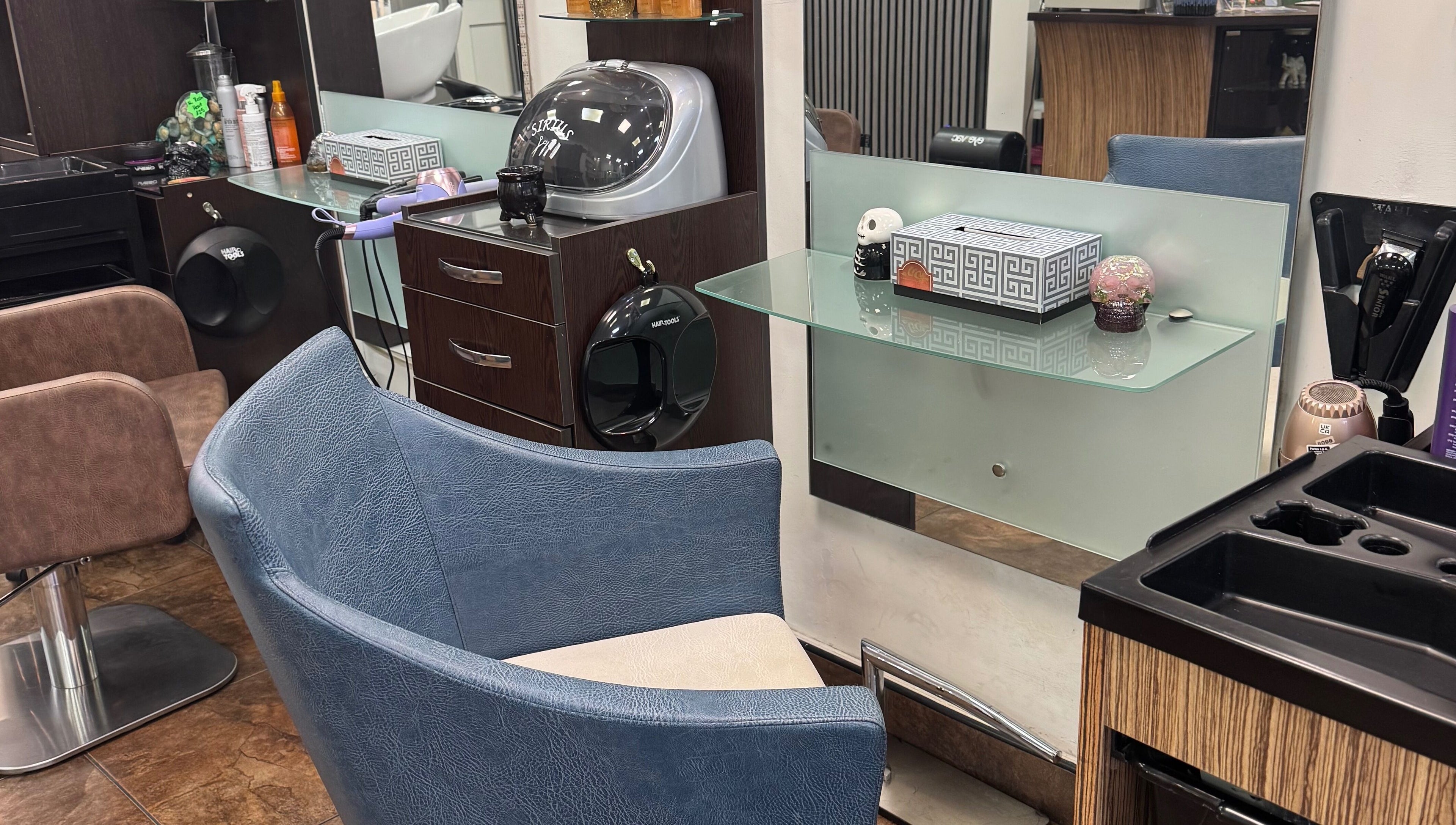 Modern salon station at Bita Hair Studio, Southampton, England, GB showcasing sleek design and styling tools.