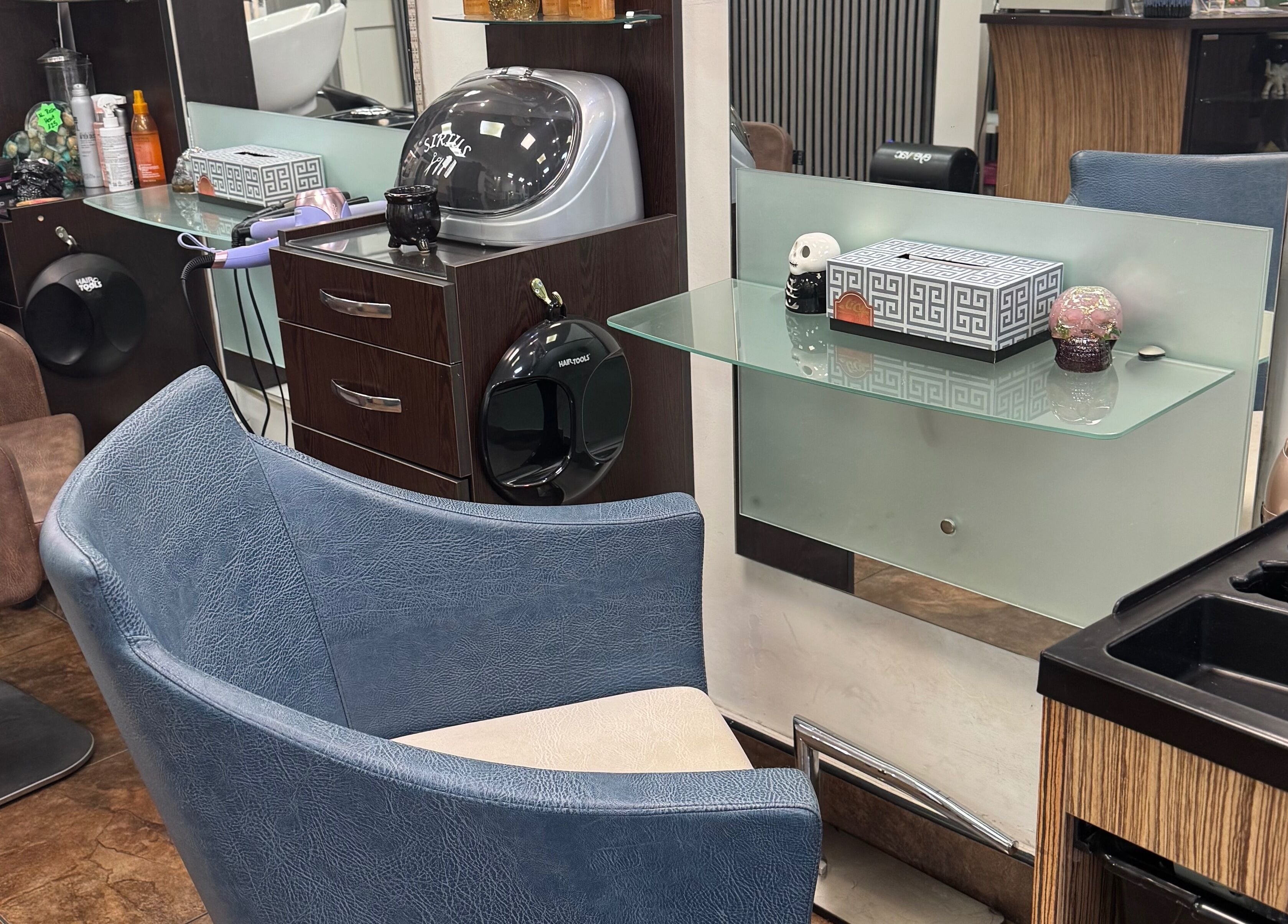 Modern salon station at Bita Hair Studio, Southampton, England, GB showcasing sleek design and styling tools.