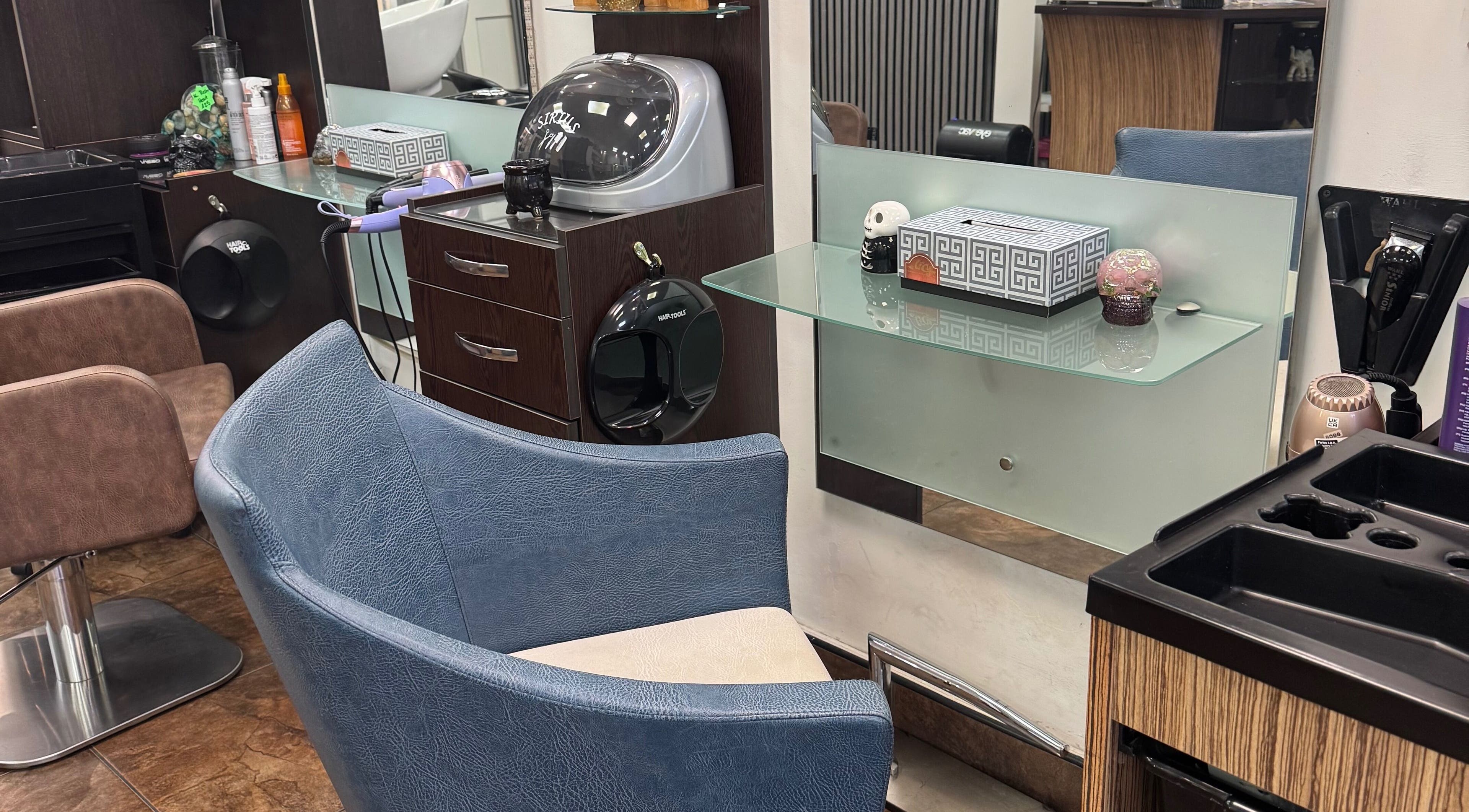 Modern salon station at Bita Hair Studio, Southampton, England, GB showcasing sleek design and styling tools.