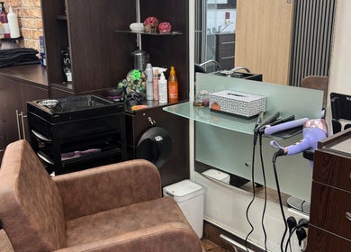 Modern styling station at Bita Hair Studio in Southampton, England, GB featuring elegant design and hair tools.