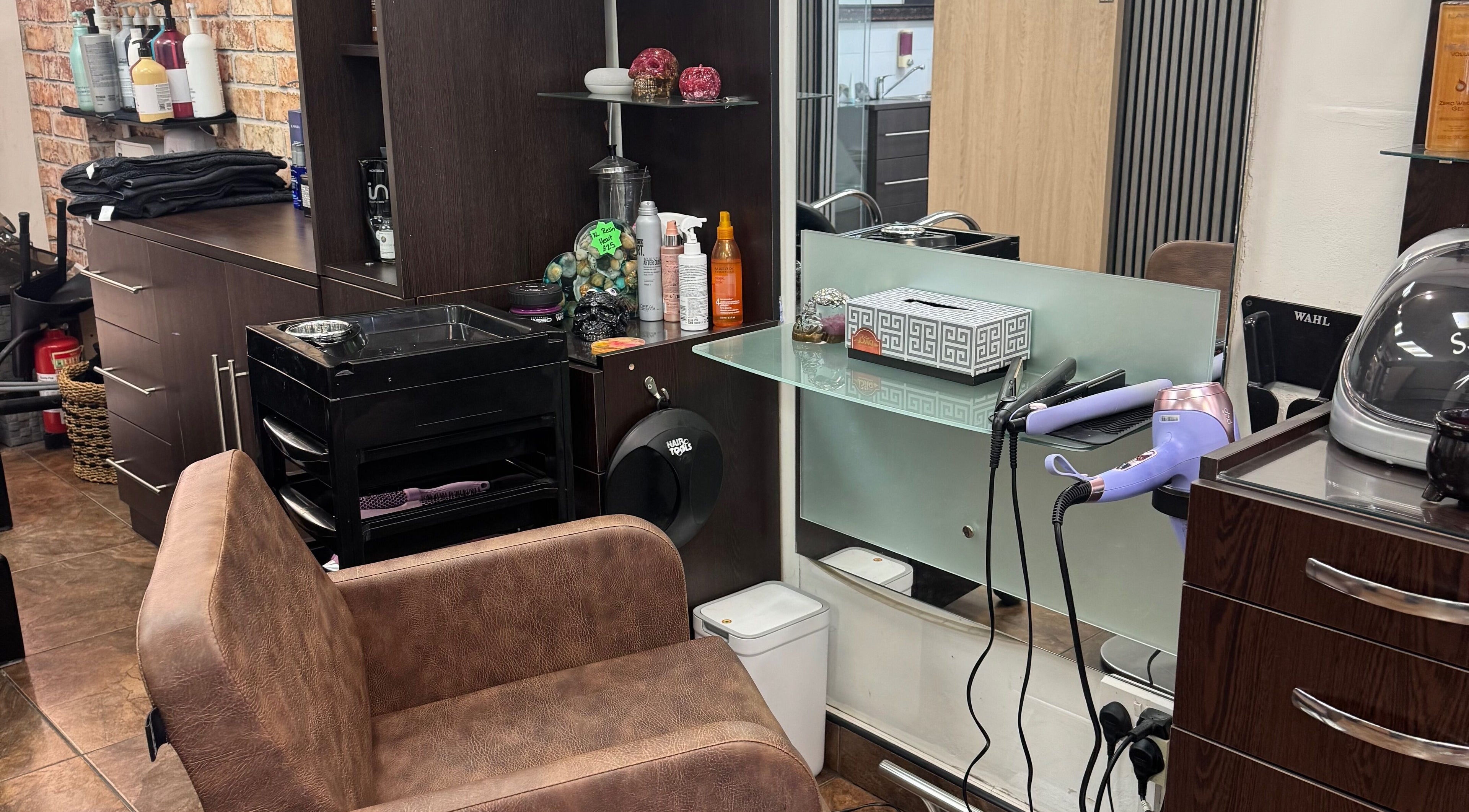Modern styling station at Bita Hair Studio in Southampton, England, GB featuring elegant design and hair tools.