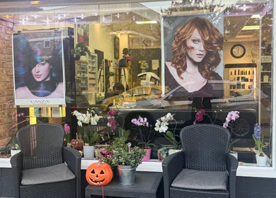 Outside view of Bita Hair Studio with elegant seating and floral decor in Southampton, England, GB.