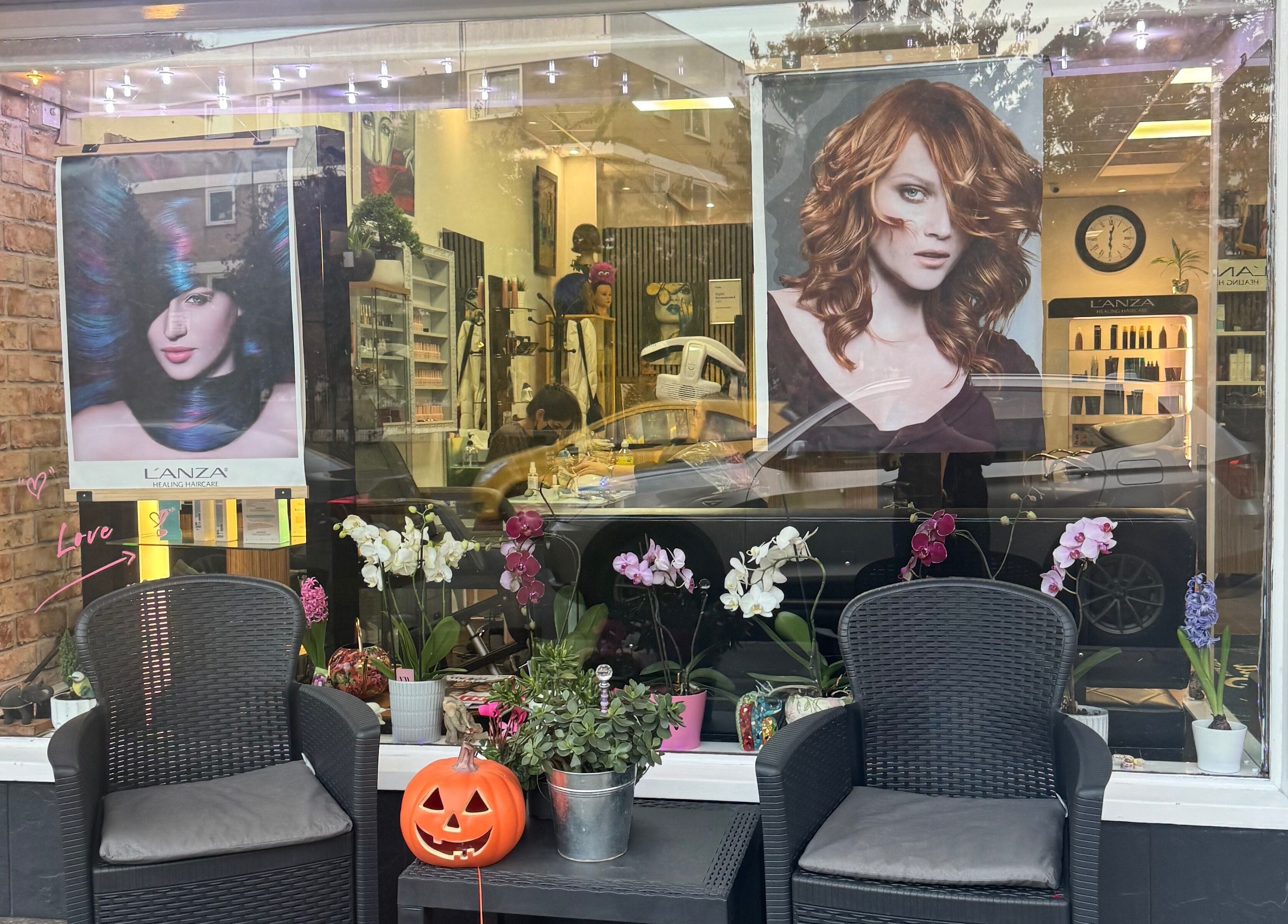Outside view of Bita Hair Studio with elegant seating and floral decor in Southampton, England, GB.