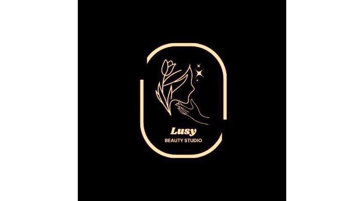 Elegant logo of Lusy Beauty Studio in Sun Valley, California, US, featuring a woman's silhouette and floral design.