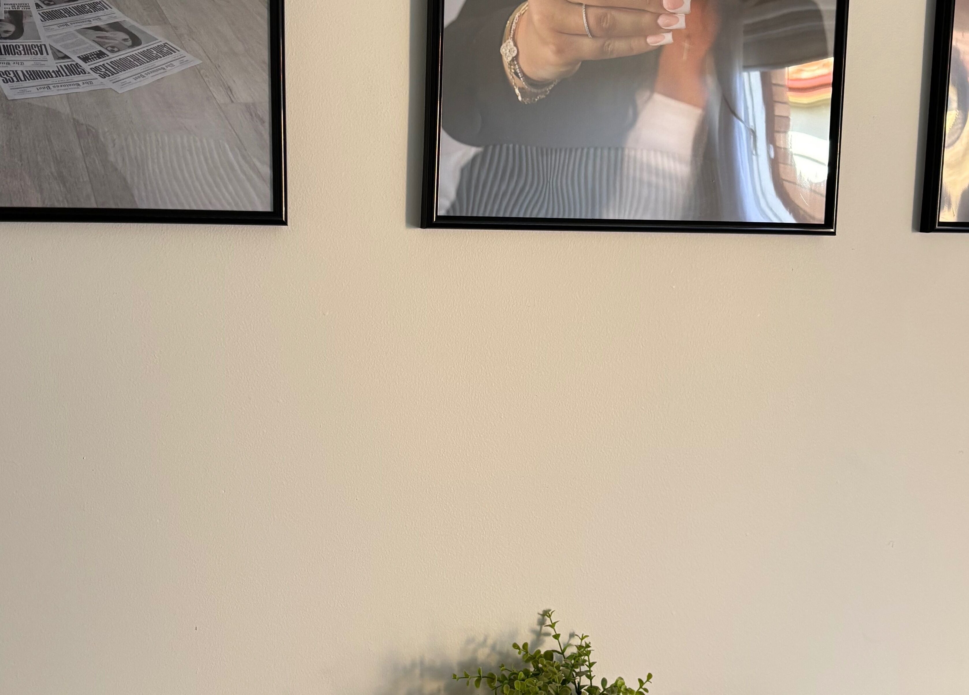 Decorative frames on wall at Lashes on the run by Jess Geelong Salon, Corio, Victoria, AU.