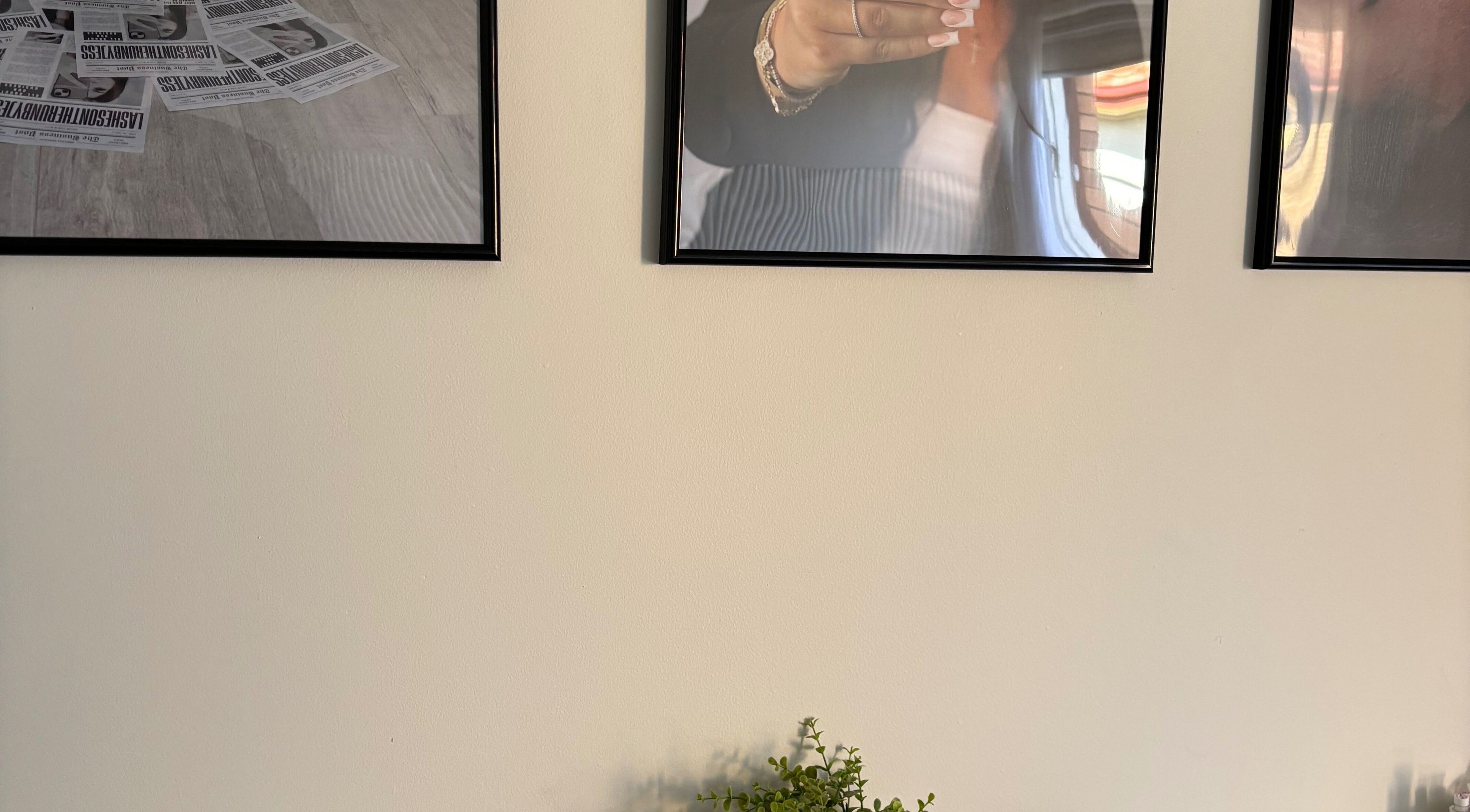 Decorative frames on wall at Lashes on the run by Jess Geelong Salon, Corio, Victoria, AU.