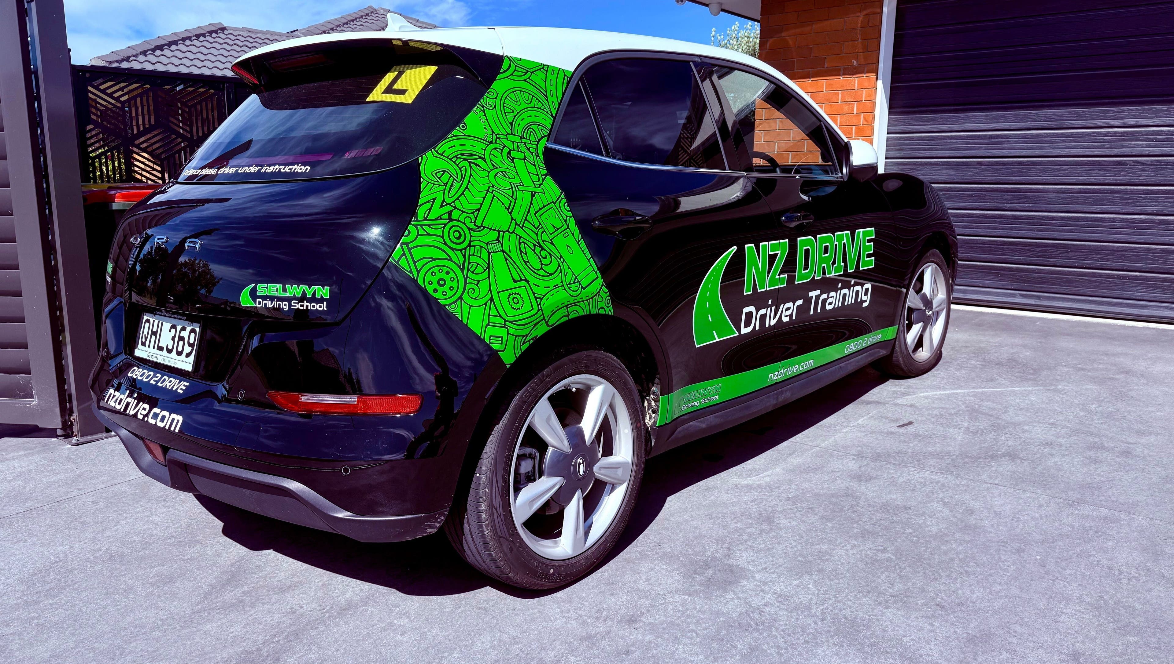 NZ Drive car at Hornby, Christchurch, Canterbury, NZ showcasing bright designs and professional driver training.