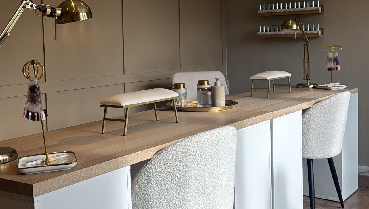 Luxurious nail station at Nails By Lucy Walsh, Llansamlet, Wales, GB with elegant decor and nail products.