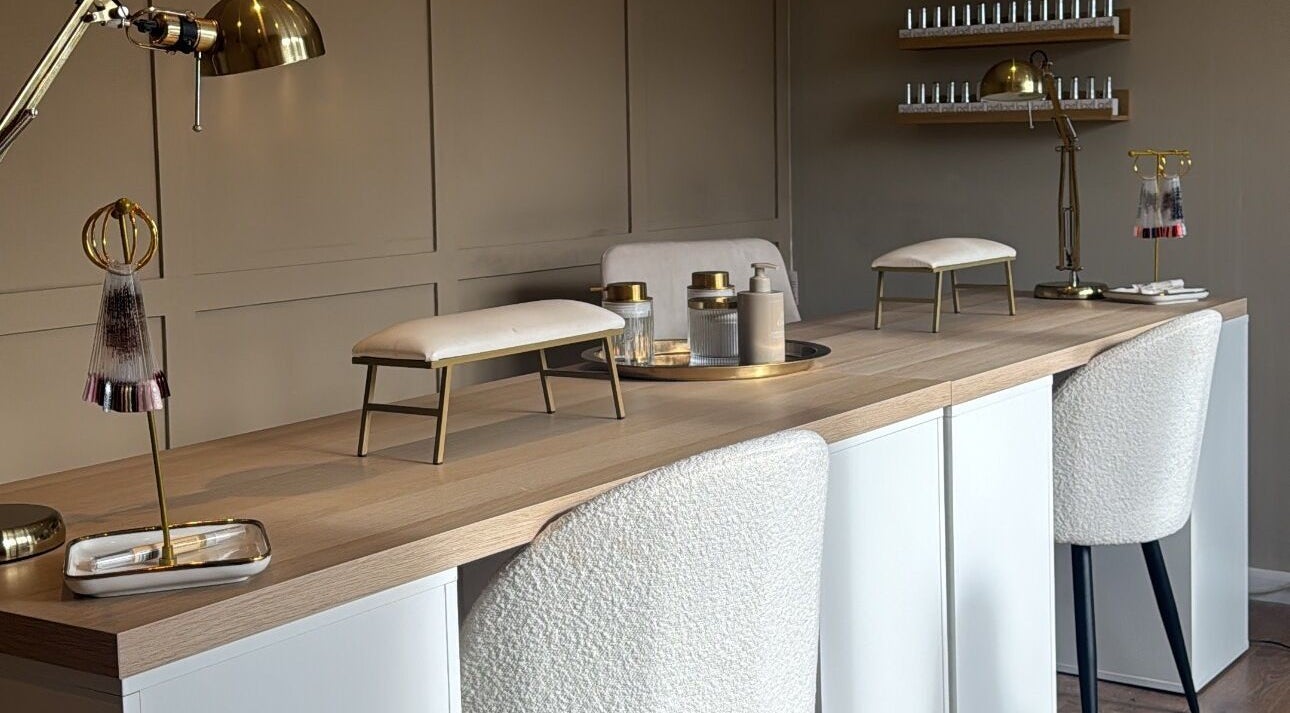 Luxurious nail station at Nails By Lucy Walsh, Llansamlet, Wales, GB with elegant decor and nail products.
