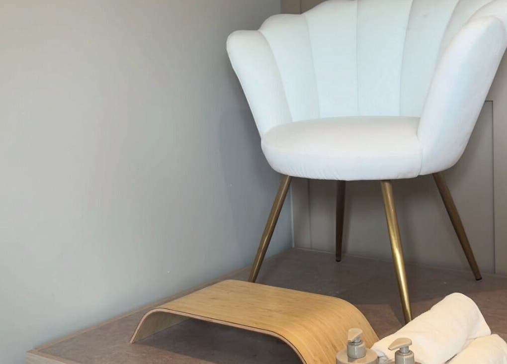 Cozy white chair and footrest at Nails By Lucy Walsh, Llansamlet, Wales, GB, offering a relaxing pedicure experience.