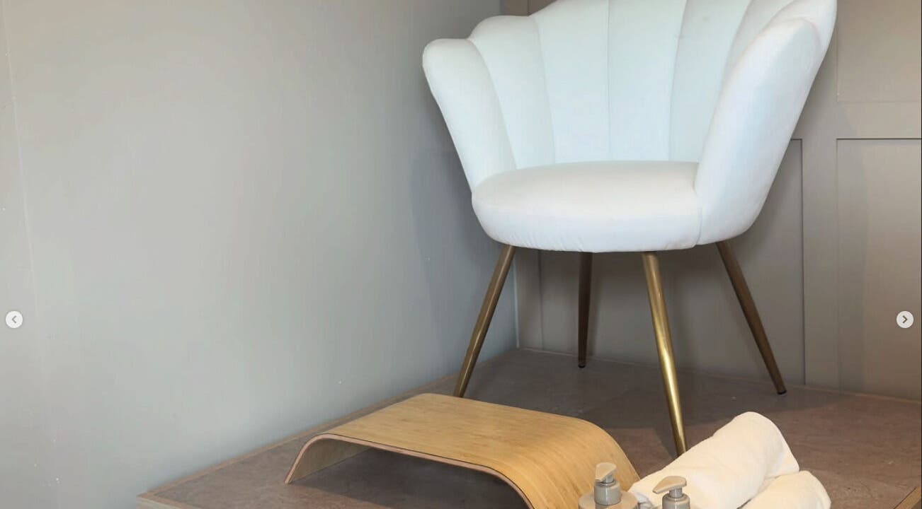 Cozy white chair and footrest at Nails By Lucy Walsh, Llansamlet, Wales, GB, offering a relaxing pedicure experience.