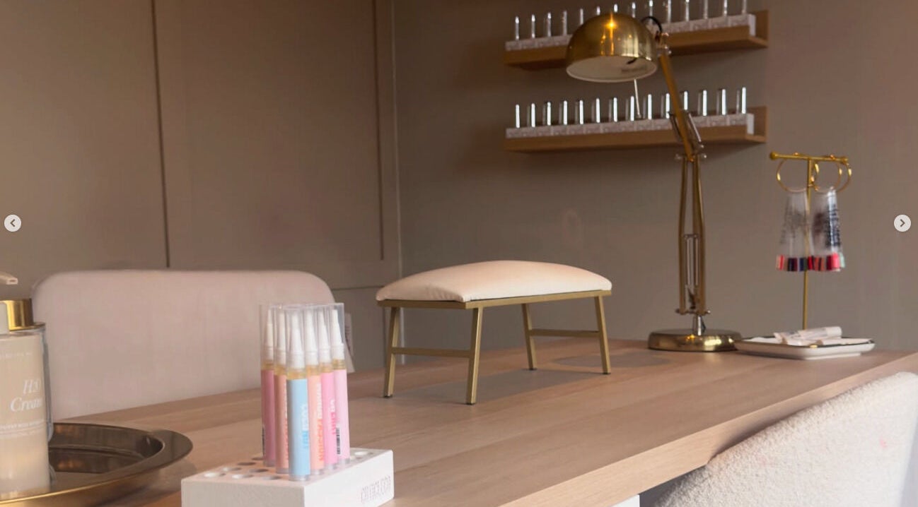 Nail table setup at Nails By Lucy Walsh in Llansamlet, Wales, GB with tools and decor.