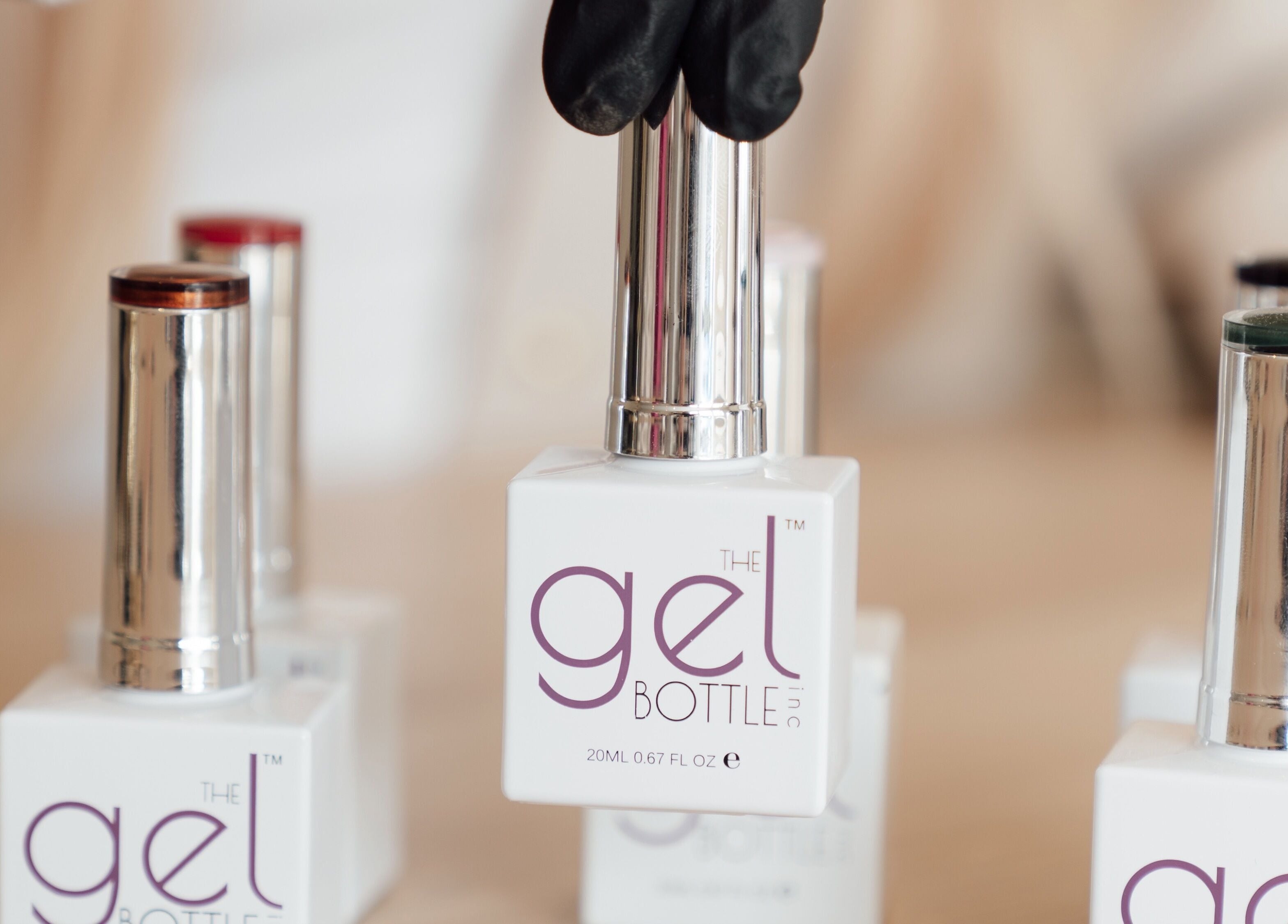 Gel nail polish bottles displayed at Nails By Lucy Walsh, Llansamlet, Wales, GB for a chic manicure.