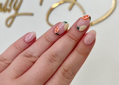 Bright citrus nail art at Sassy Beauty Collective Derby, Derby, England, GB. Vibrant, elegant manicure.