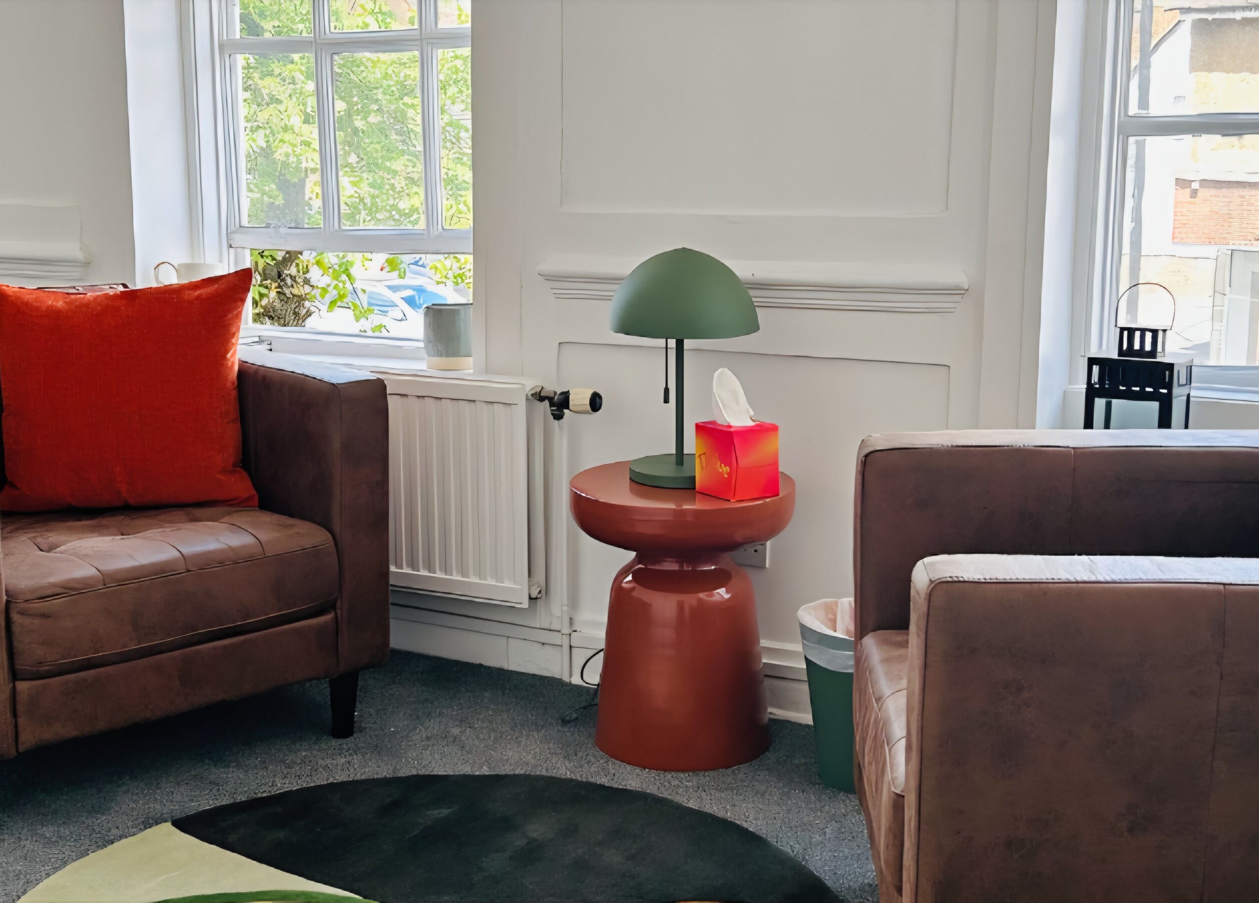 Inviting seating area at Royal Therapy Centre, Stevenage, England, GB with plush chairs and a stylish lamp.