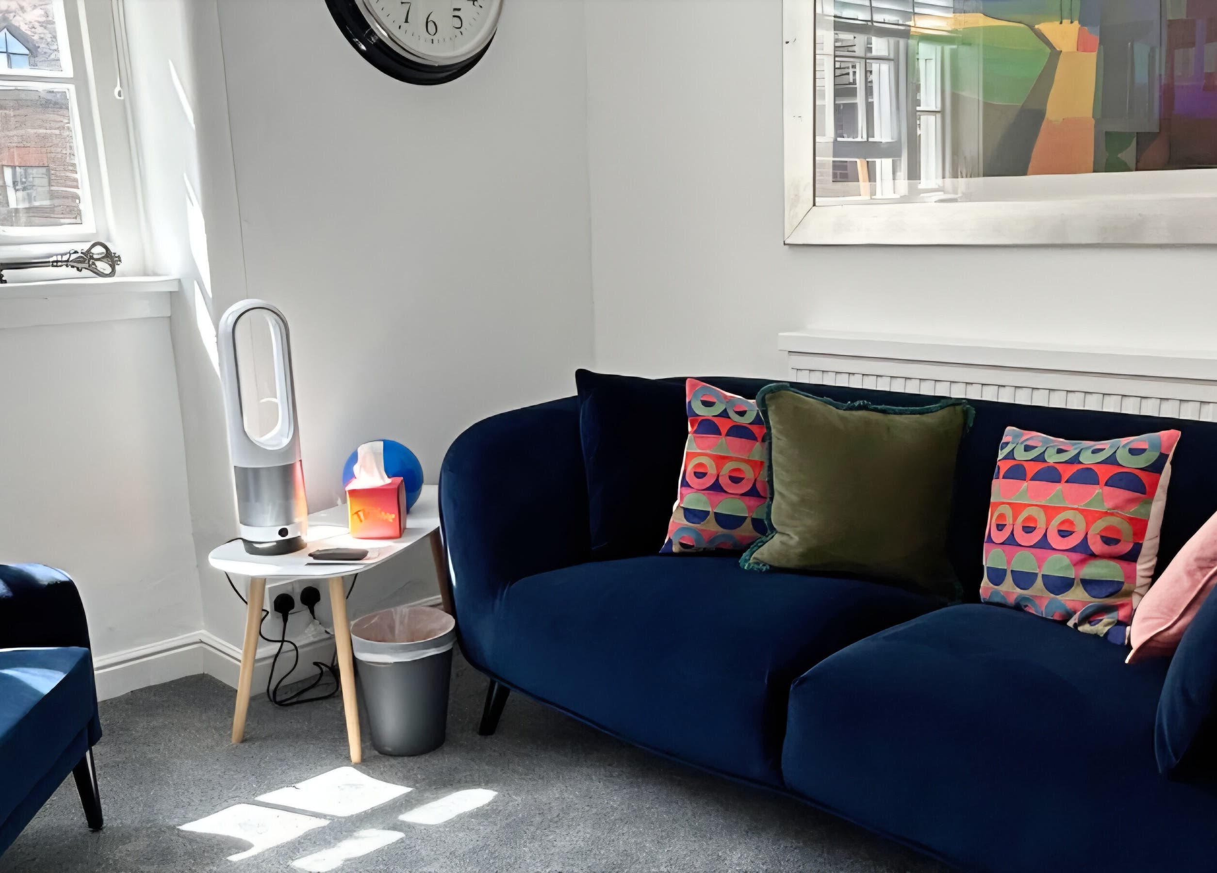 Elegant lounge at Royal Therapy Centre, Stevenage, England, GB with colorful cushions and modern decor.