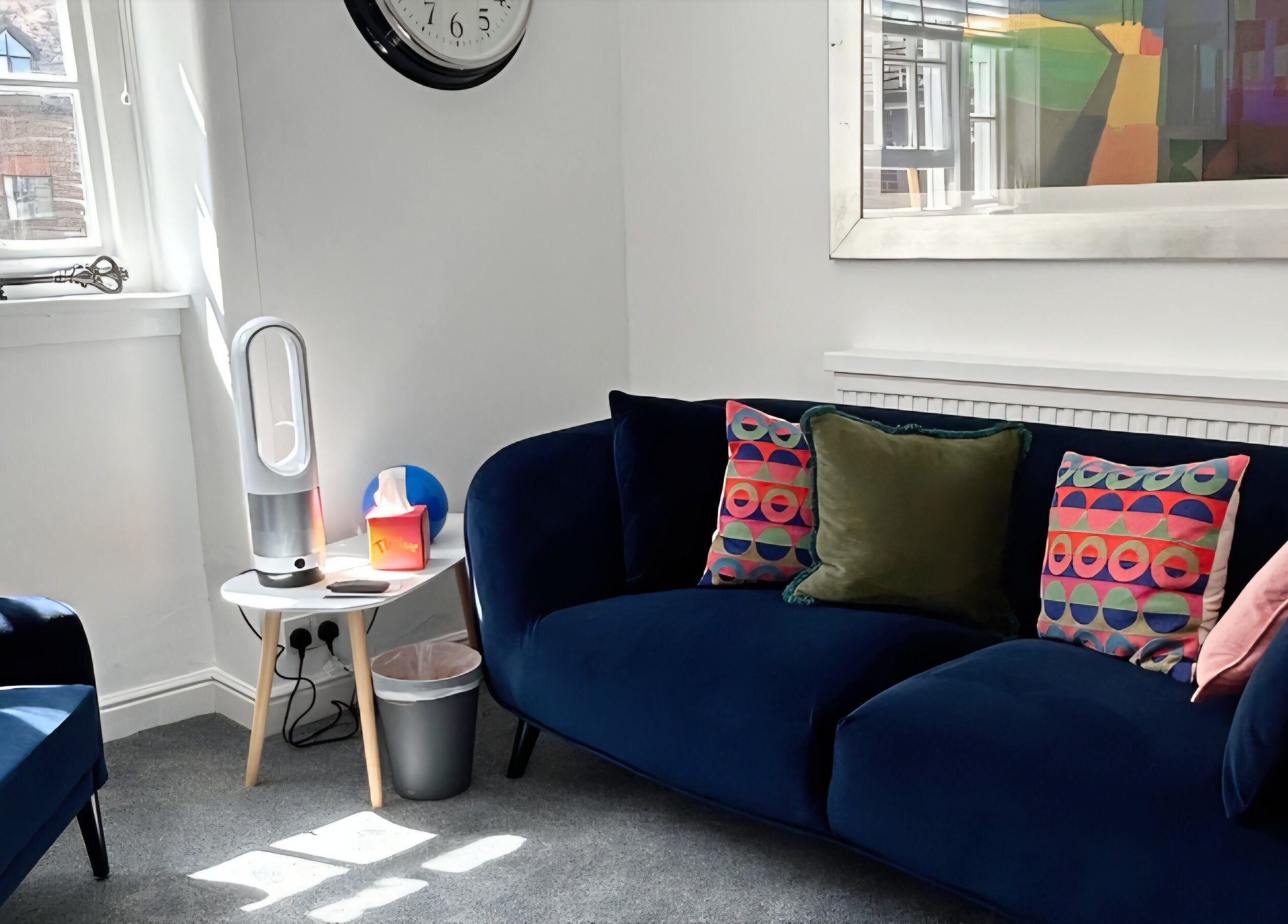 Elegant lounge at Royal Therapy Centre, Stevenage, England, GB with colorful cushions and modern decor.