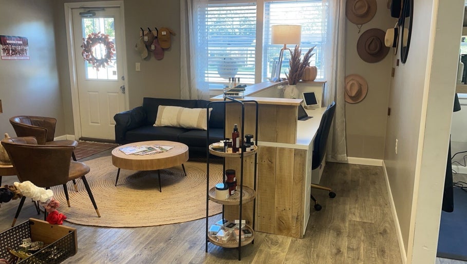 Welcoming lounge at 419 Hair & Co, Saint Henry, Ohio featuring stylish seating and display.