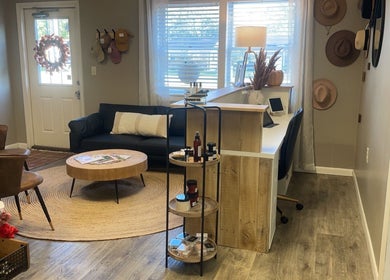 Welcoming lounge at 419 Hair & Co, Saint Henry, Ohio featuring stylish seating and display.
