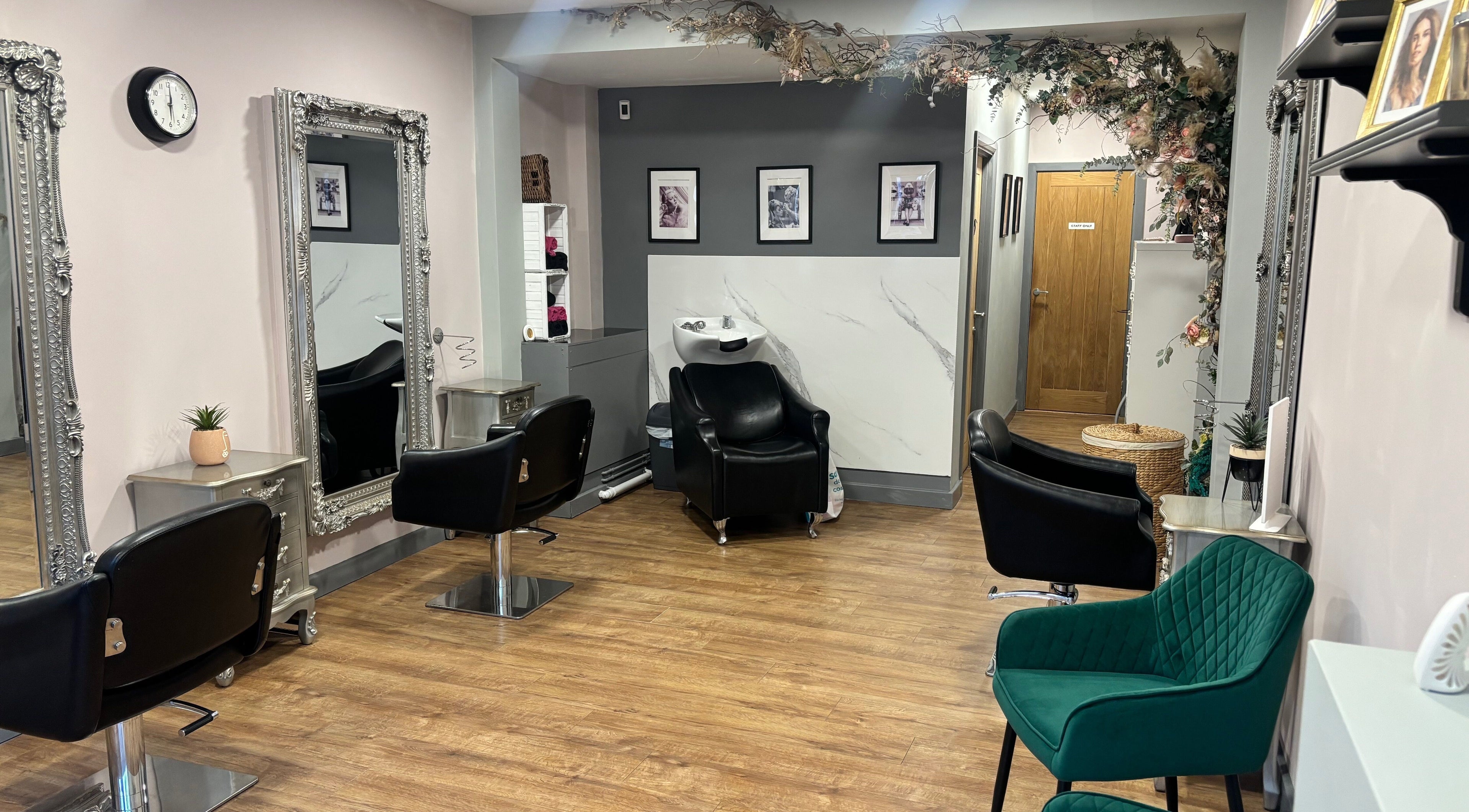 Chic interior of The Lash Lounge Hair & Beauty Boutique in Beeston, England, GB featuring elegant styling stations.