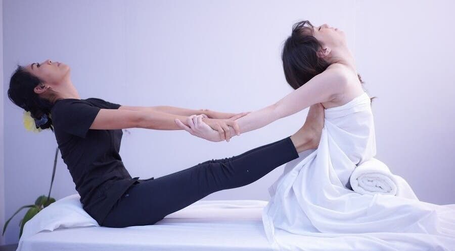 Therapist guiding a stretching session at Bua Thai Massage, Las Vegas, Nevada, US.