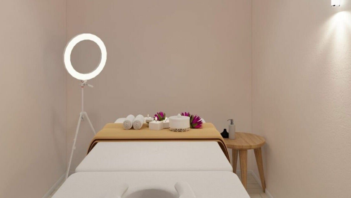 Relaxing spa room at Gro Wellness Asia 佫洛养生轩 (Farrer Park), Singapore, SG with massage table and warm lighting.
