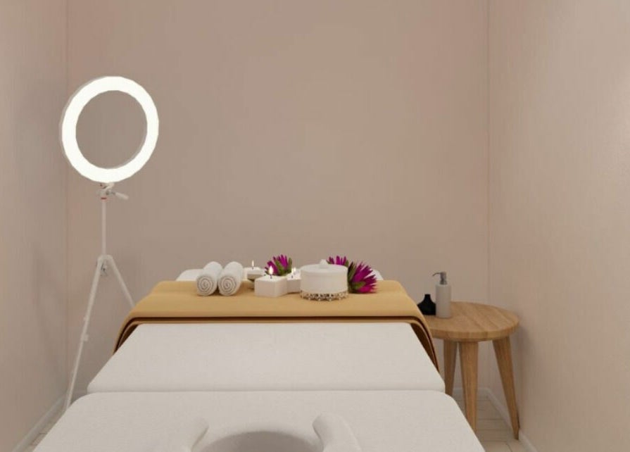 Relaxing spa room at Gro Wellness Asia 佫洛养生轩 (Farrer Park), Singapore, SG with massage table and warm lighting.