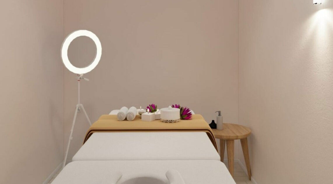 Relaxing spa room at Gro Wellness Asia 佫洛养生轩 (Farrer Park), Singapore, SG with massage table and warm lighting.