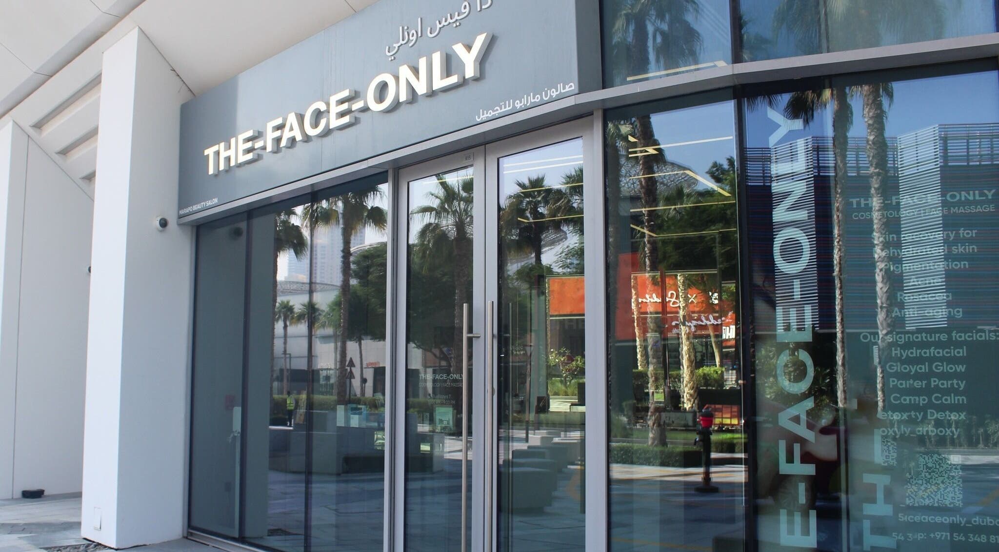 Entrance of The Face Only in Dubai, Dubai, AE, showcasing elegant glass facade and inviting ambiance.