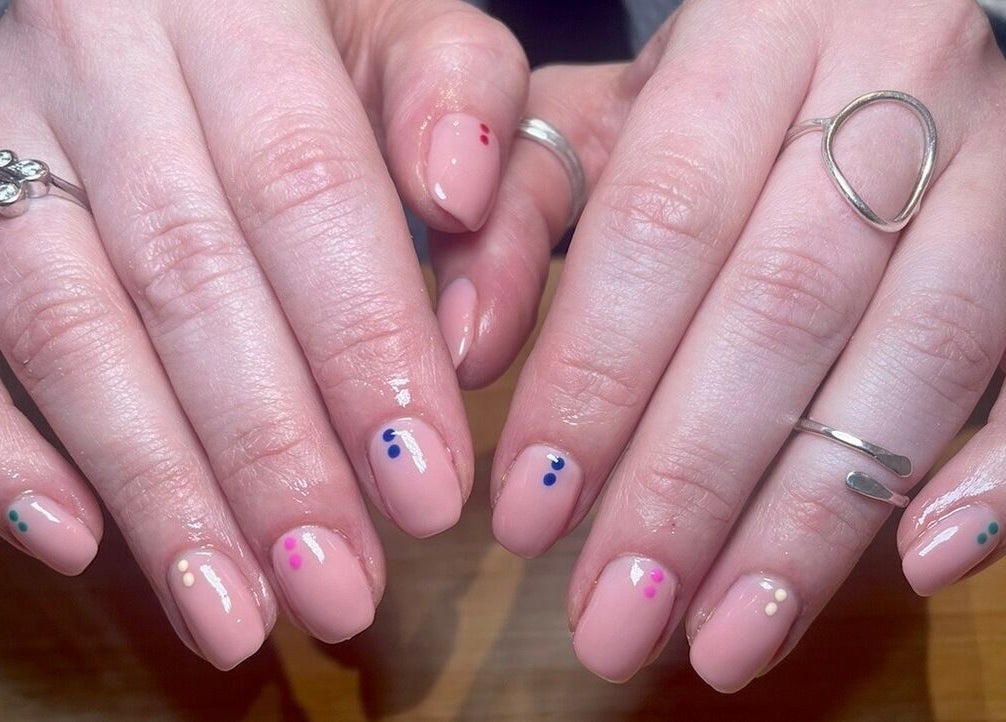Stylish polka dot nail art at Gee Gee's Beauty, Nantwich, England, GB, showcasing creative manicure design.