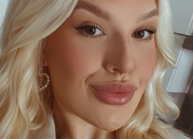 Close-up of a customer at Gee Gee's Beauty, showcasing styled hair and makeup in Nantwich, England, GB.