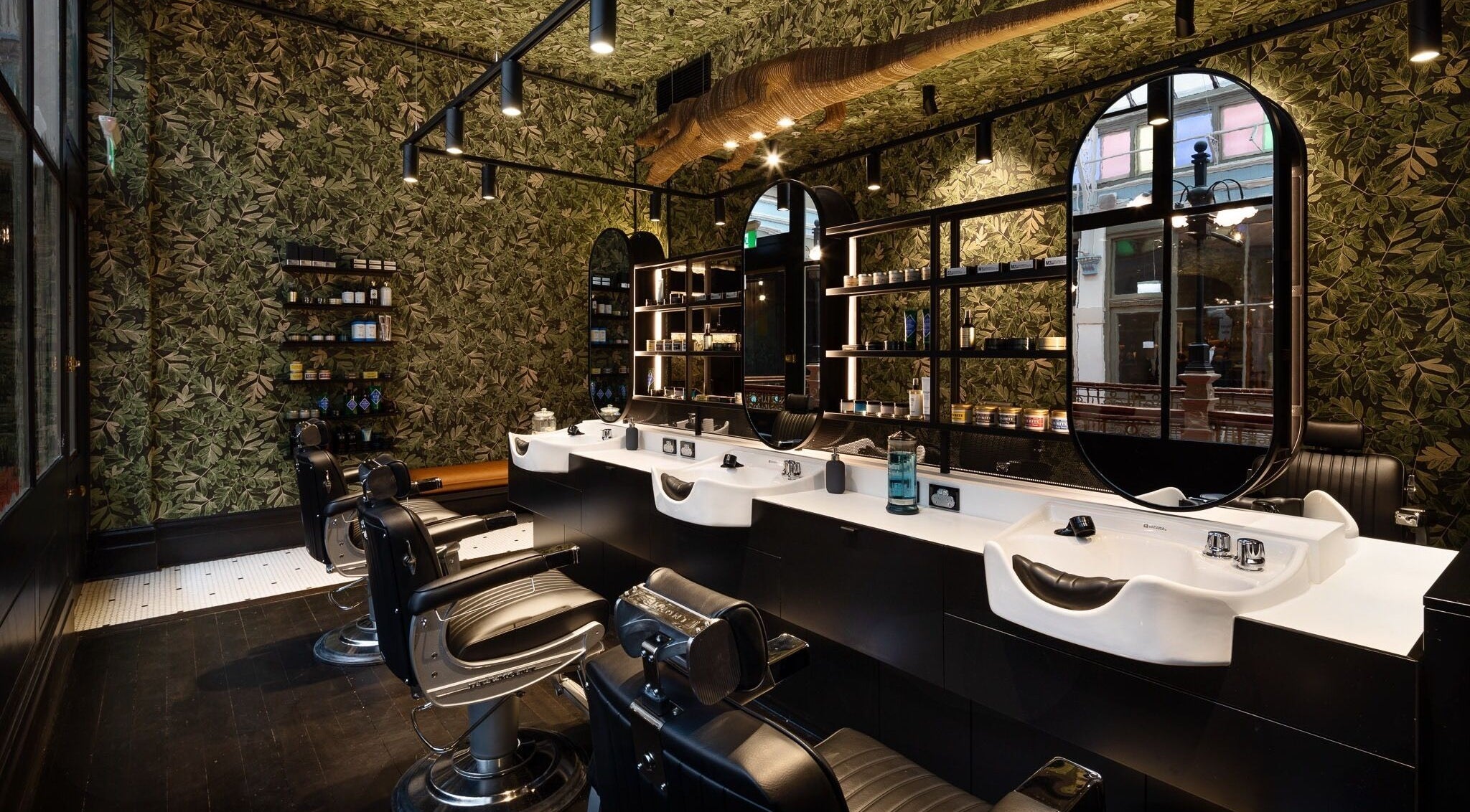 Modern barbershop with jungle decor at NOAH Sydney, located in Sydney, New South Wales, AU.