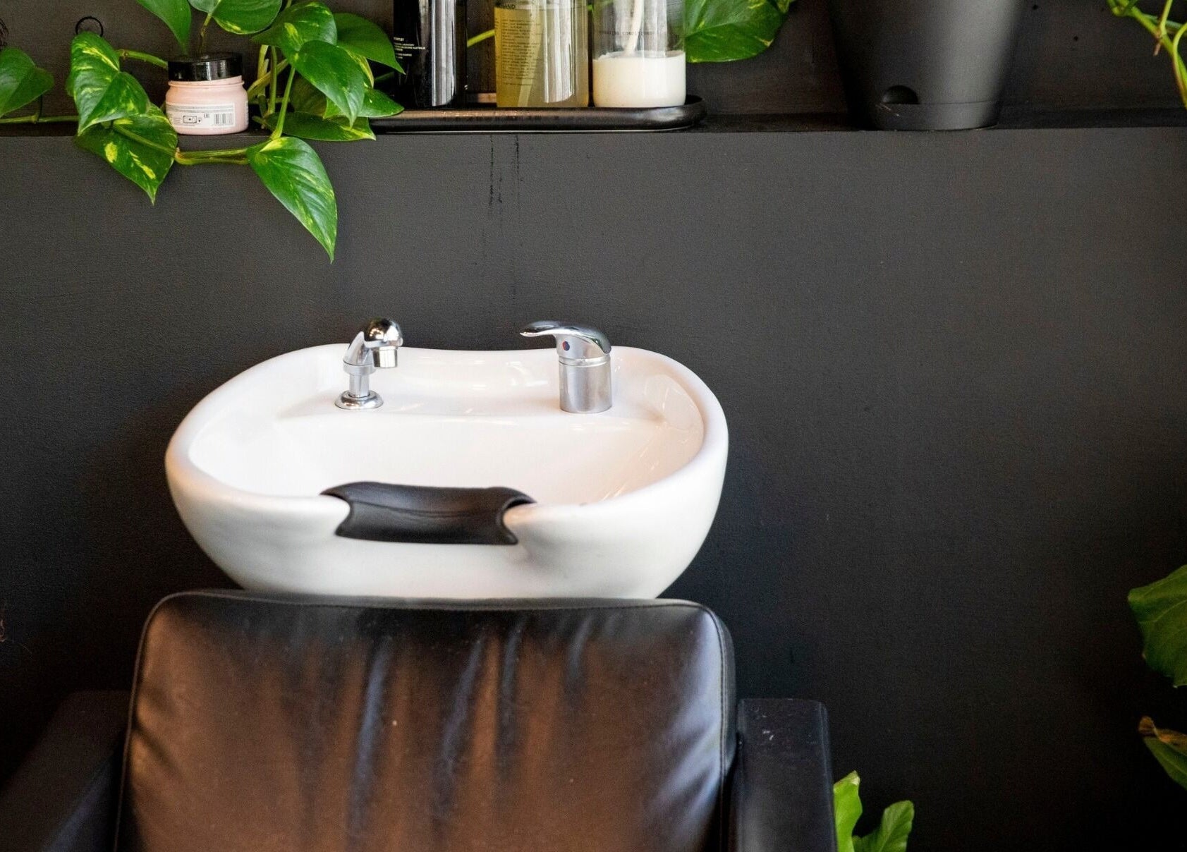 A sleek salon sink with greenery at NOAH Canberra, Canberra, Australian Capital Territory, AU.