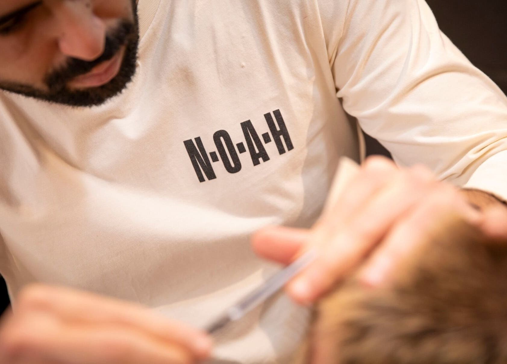 A stylist from NOAH Canberra performs detailed grooming in Canberra, Australian Capital Territory, AU.