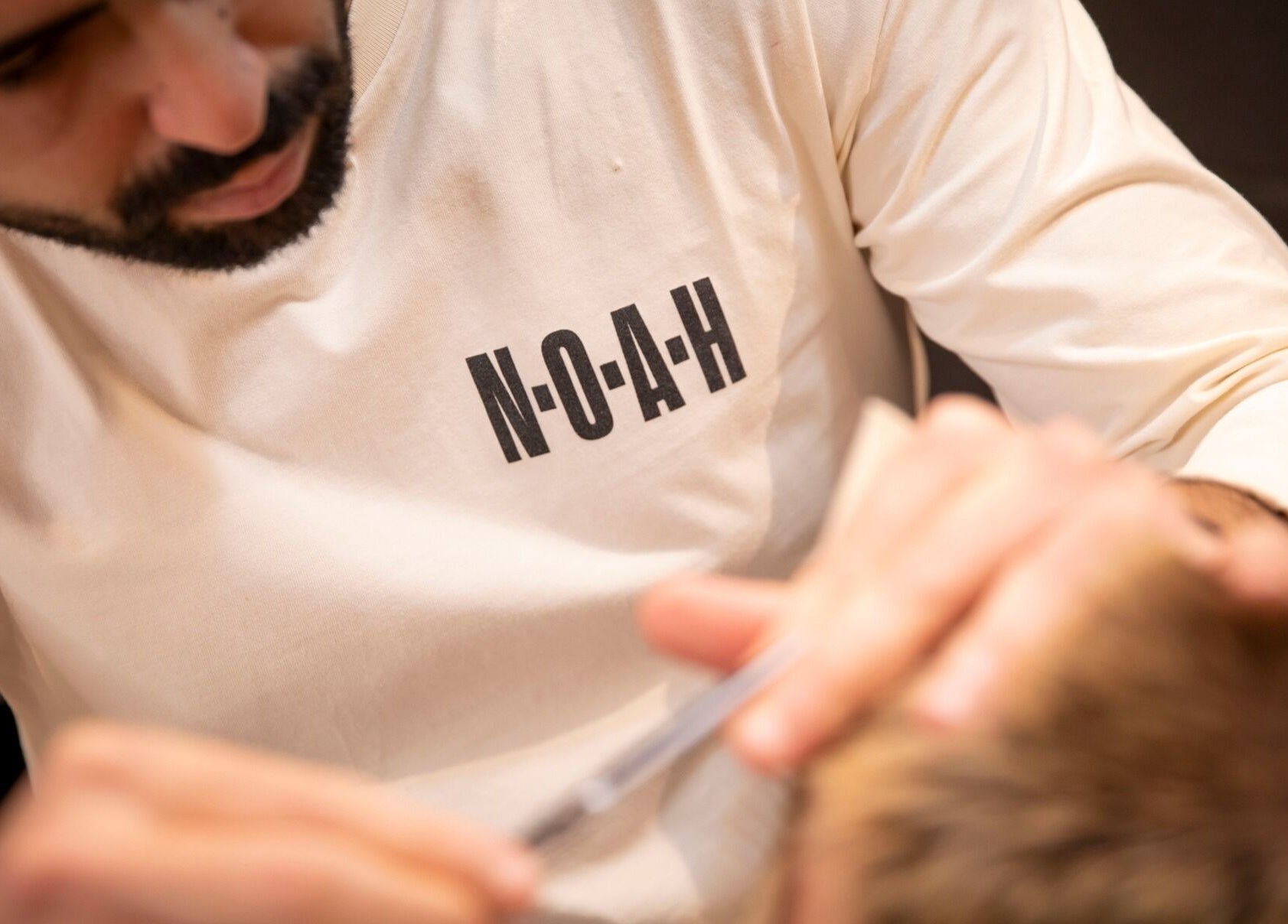 A stylist from NOAH Canberra performs detailed grooming in Canberra, Australian Capital Territory, AU.