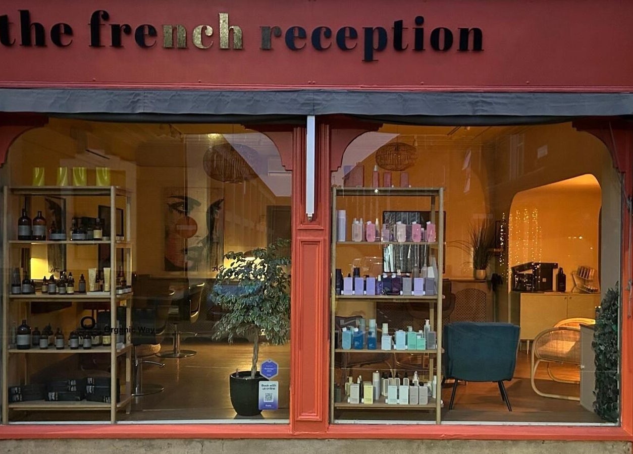 The French Reception, a chic beauty venue in Harrogate, England, GB, displaying elegant products through large windows.