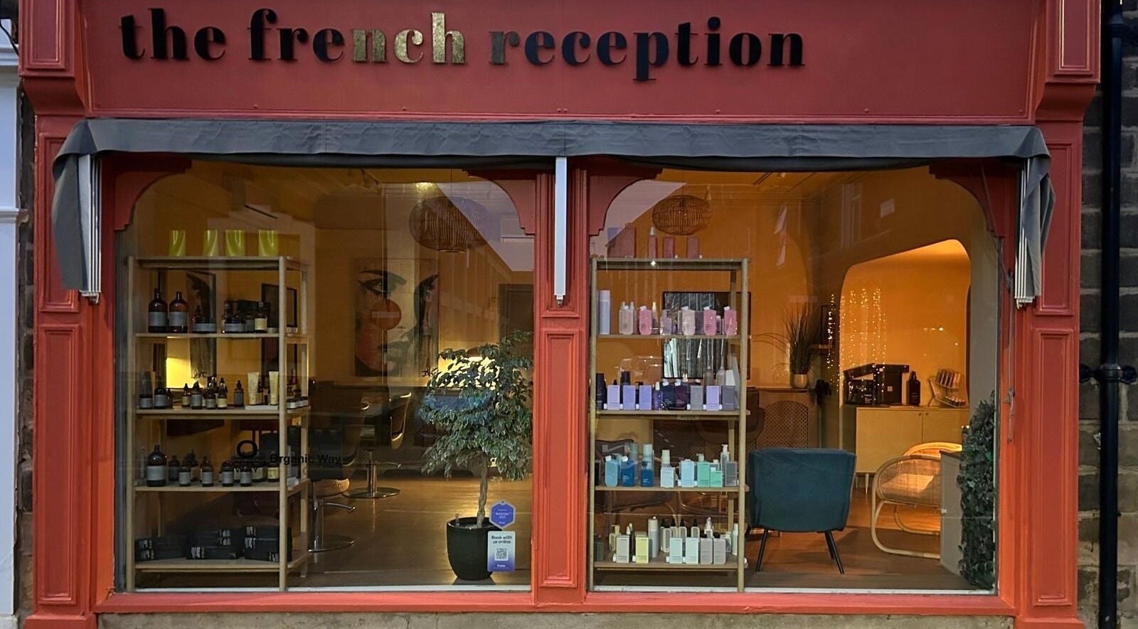The French Reception, a chic beauty venue in Harrogate, England, GB, displaying elegant products through large windows.