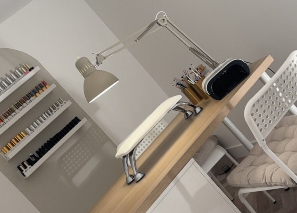 Modern nail station with polish racks at Get Glam By Alix Bulloch in Edinburgh, Scotland, GB.