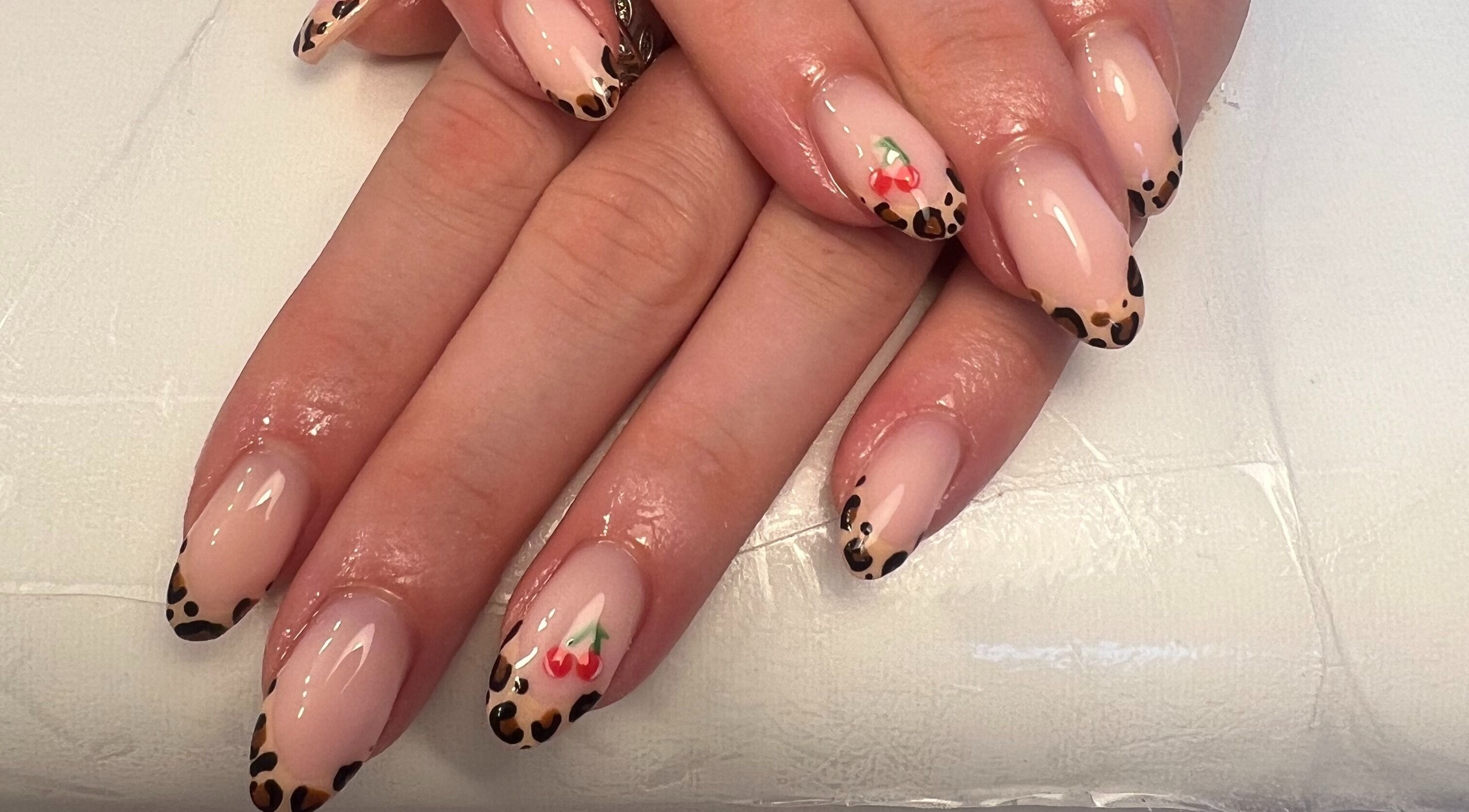 Leopard print nail art with cherry design at Get Glam By Alix Bulloch, Edinburgh, Scotland, GB.
